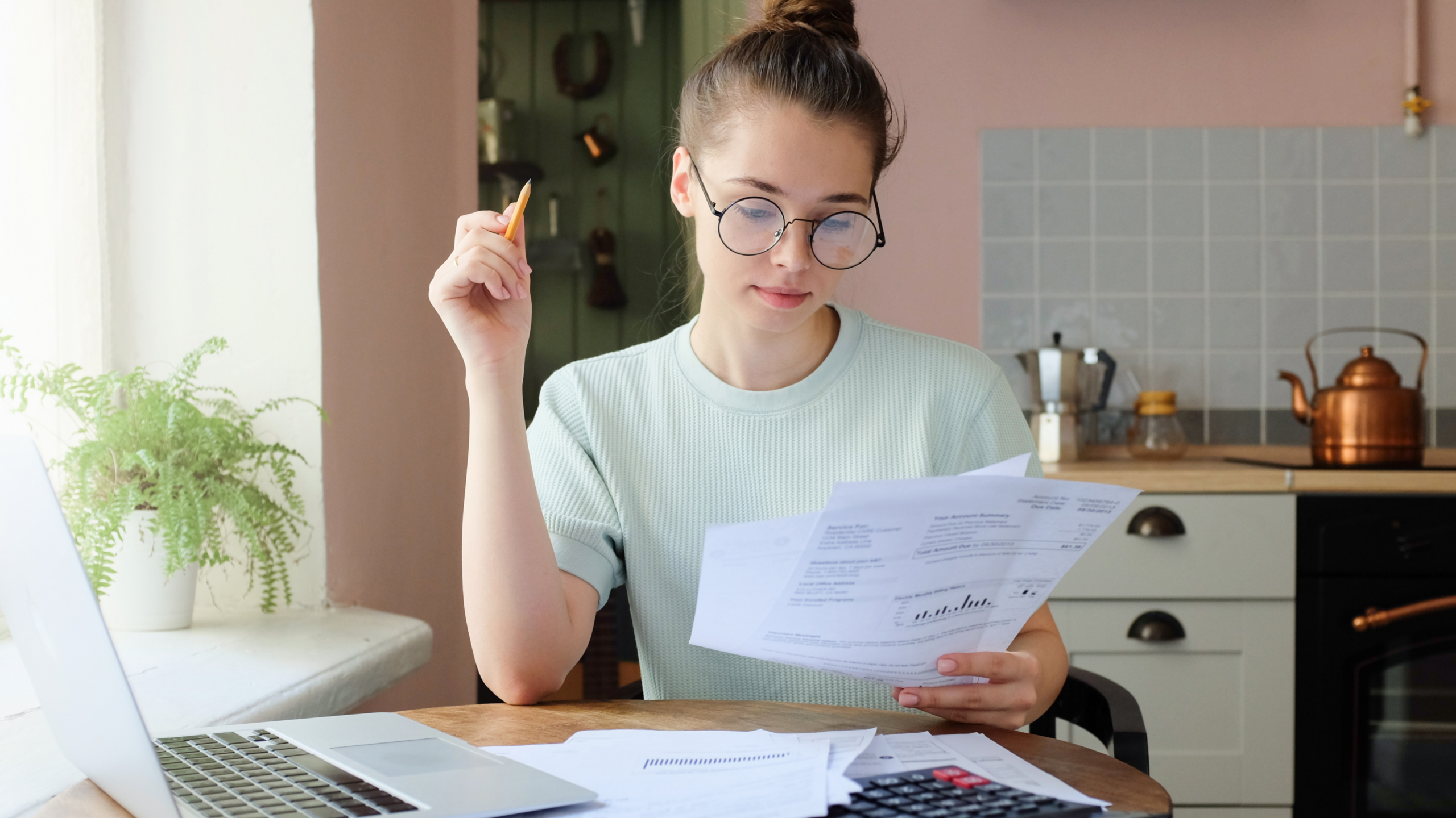 An image of young woman business owner doing her bookkeeping