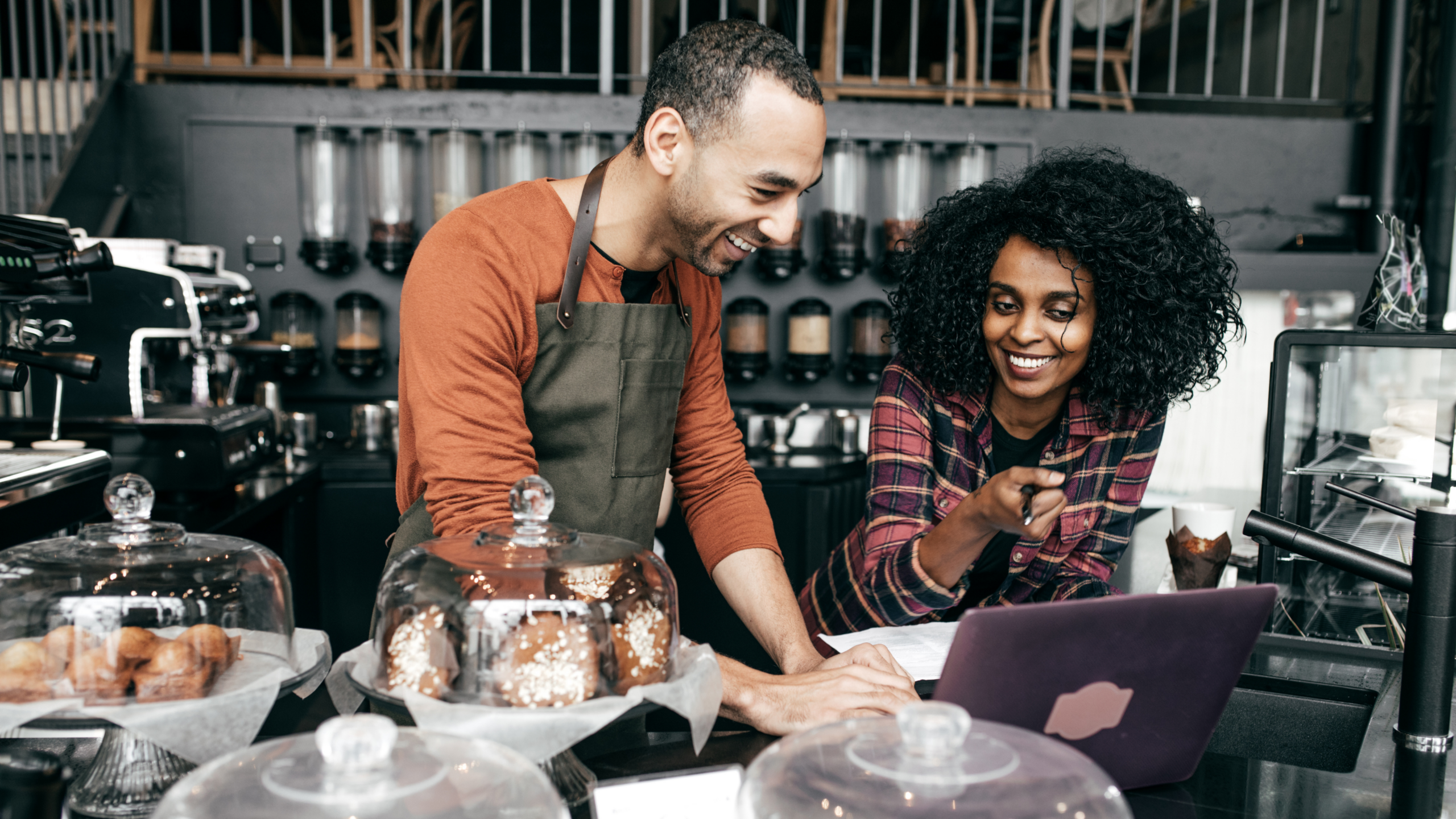 An image of two business owners in their hospitality business