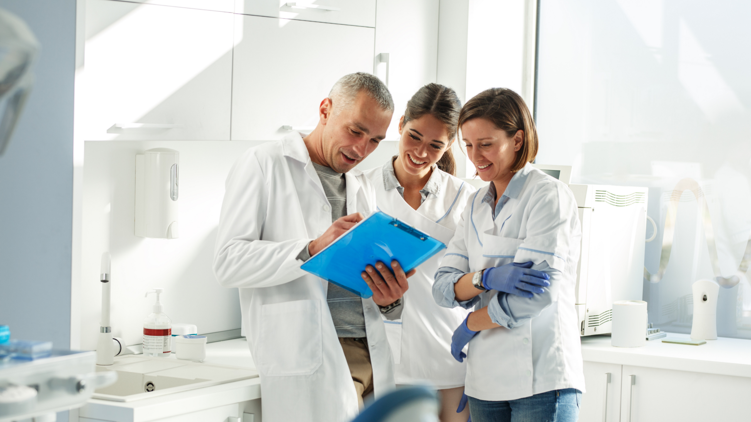 An image of staff talking at a dental professional service office