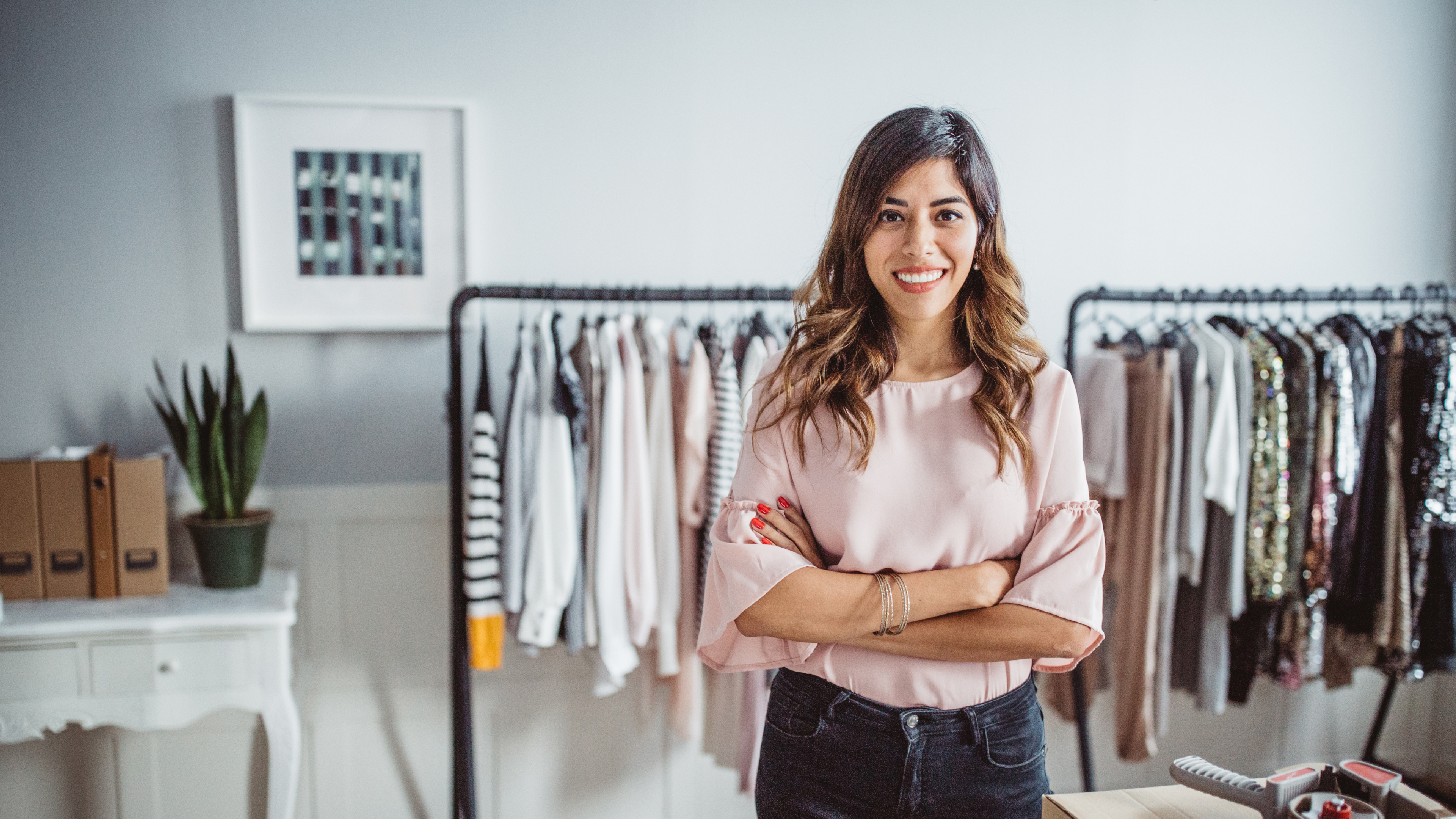 An image of a female business owner in her retail business