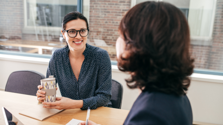 An image of two small business owners discussing their cloud accounting solution