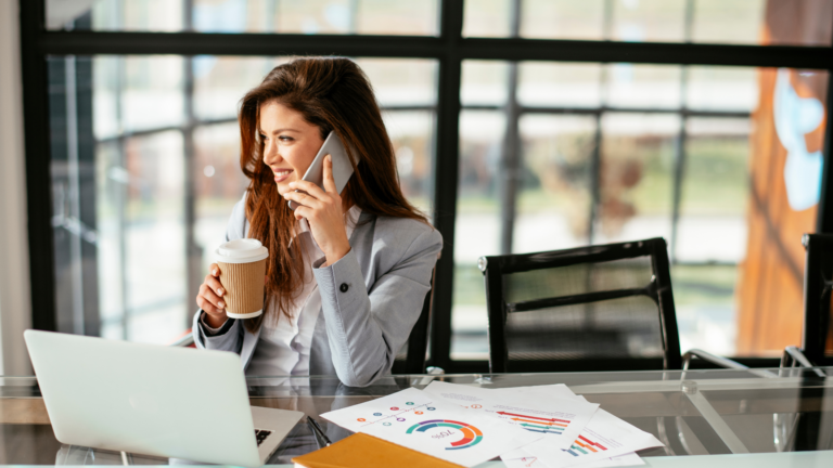 An image of a small business owner on her phone discussing Lifetime Capital Gains Exemptions