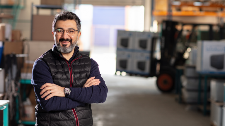 An image of a small business owner who is keeping his small business finances organized.