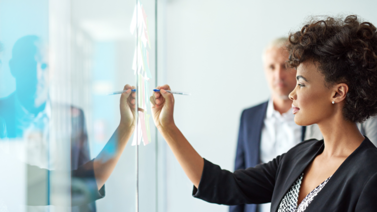 An image of a small business owner reviewing exit strategies with another team member.
