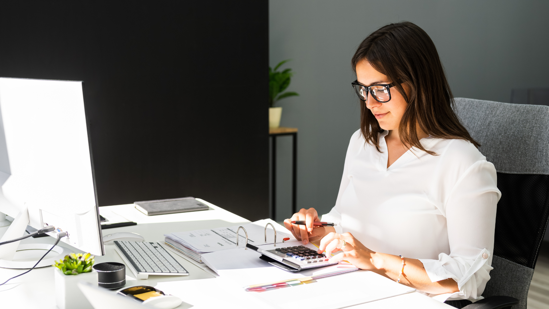 An image of a small business owner who is considering outsourcing bookkeeping to their local CPA firm in Markham