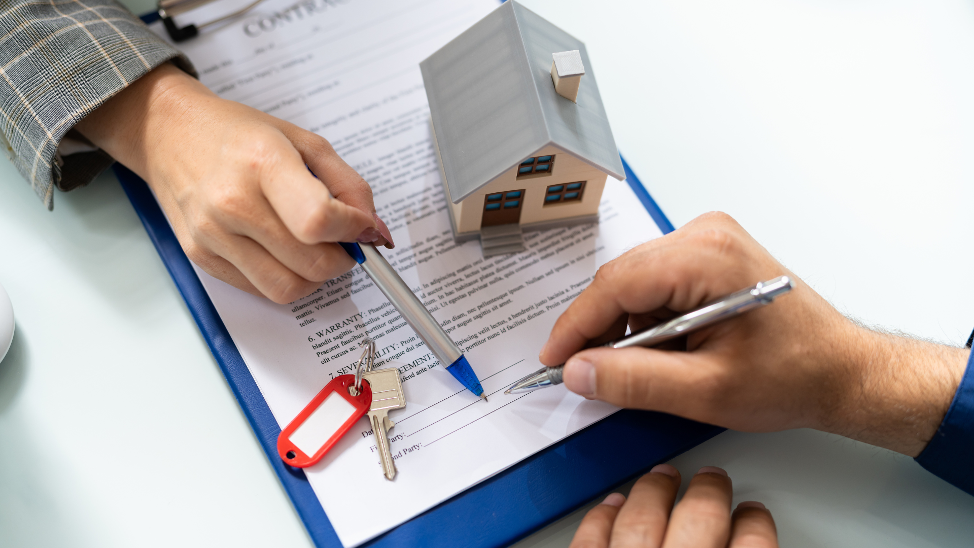 An image of a small business owner selling a property and completing the paperwork