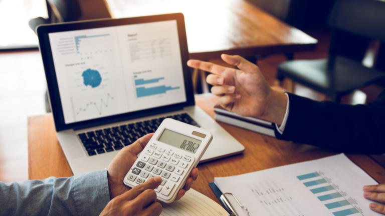 An image of a CPA in Markham helping his small business client manager their overhead costs.