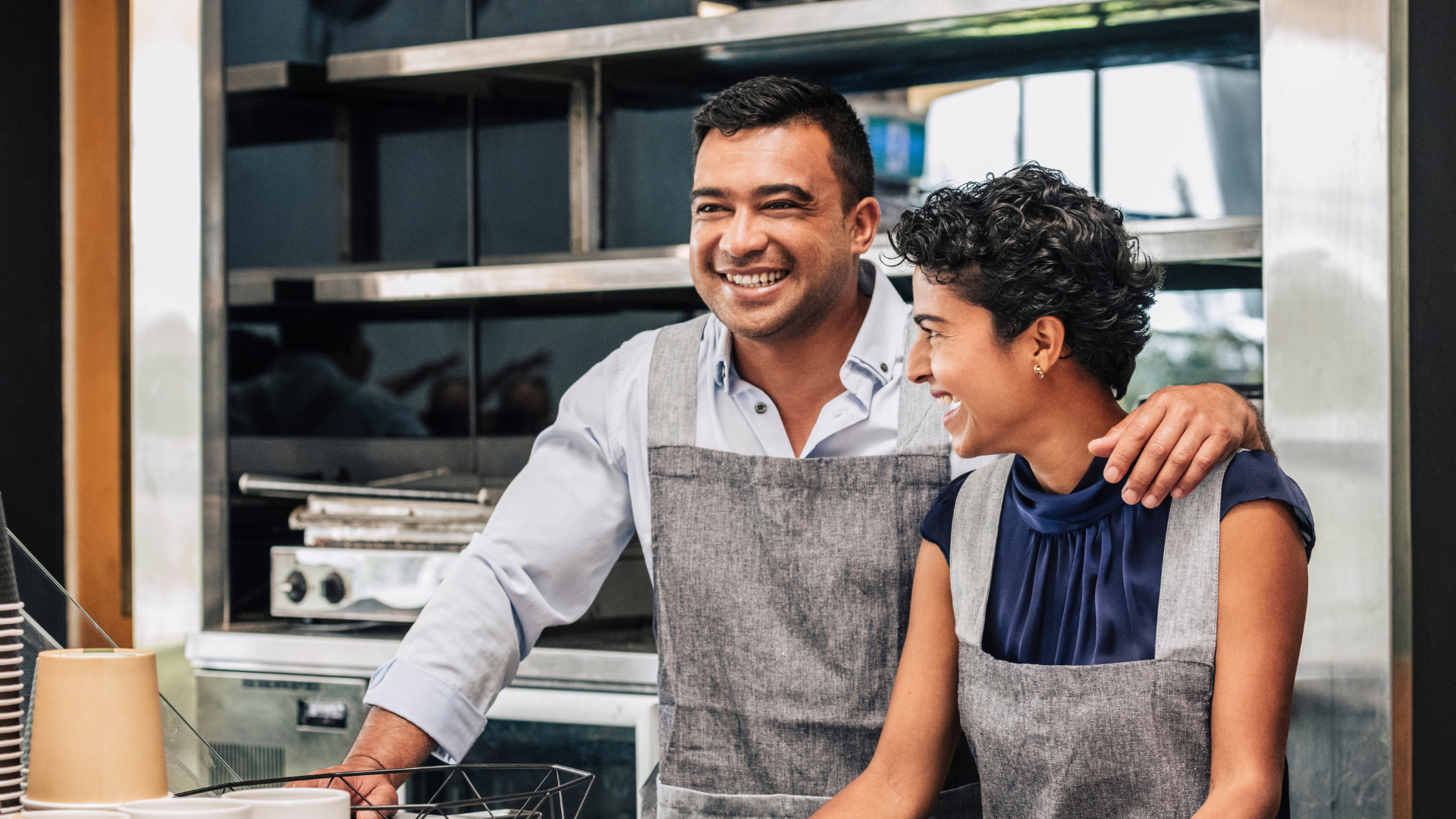 Two small business owners working together in their small coffee shop in Markham Ontario