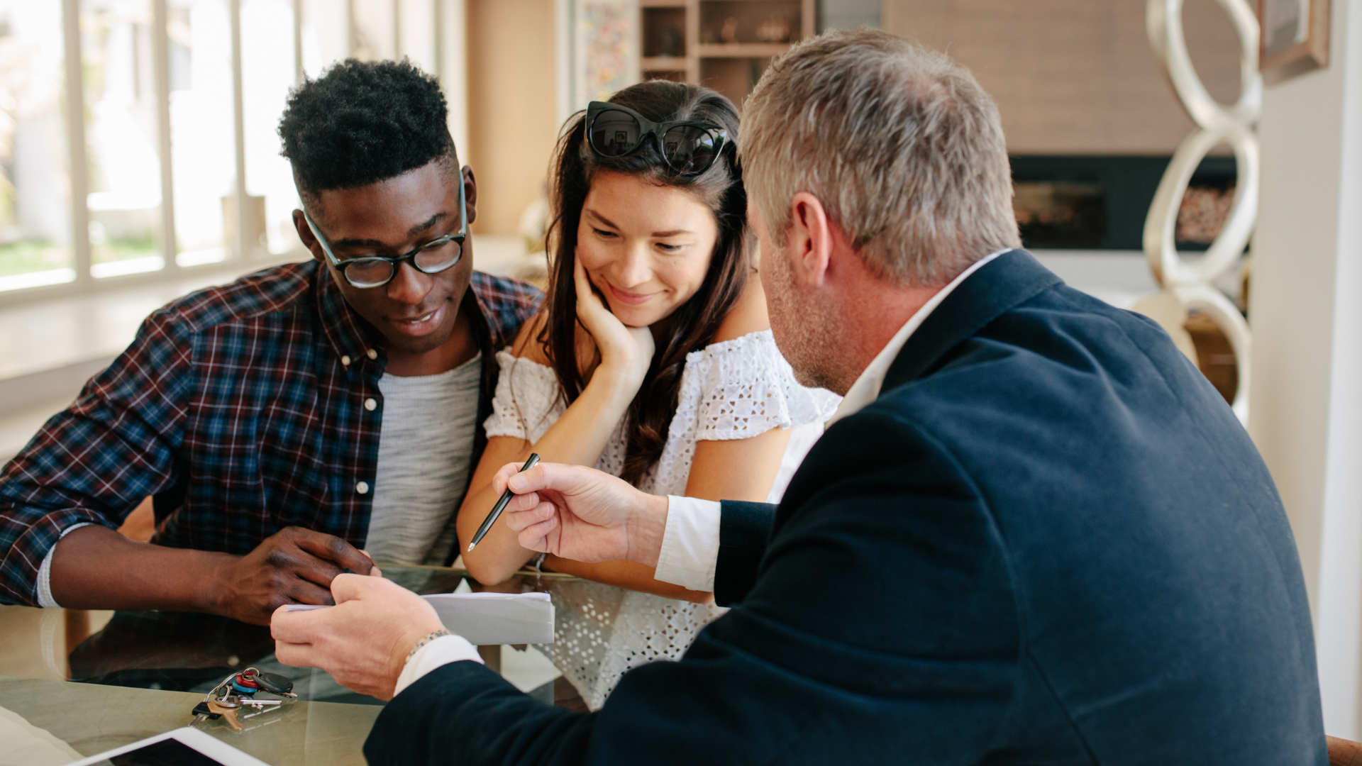 An image of a Markham real estate agent meeting with his clients.