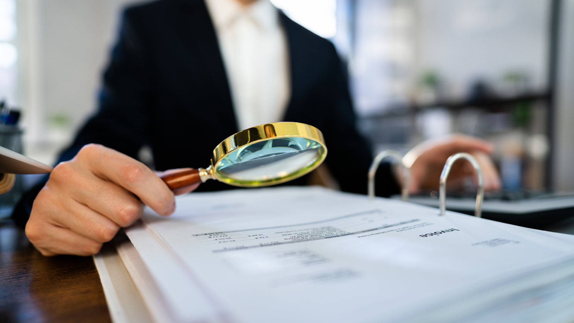 An image of a Markham accountant examining some documents for a CRA Audit