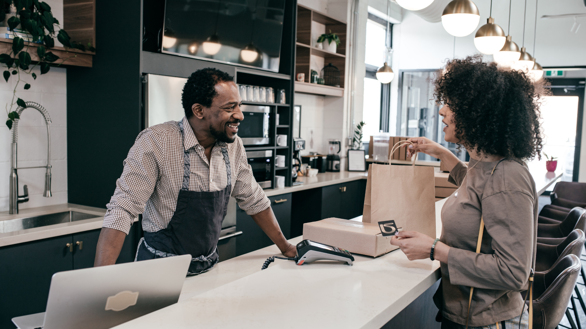 An image of a small Markham retailer chatting with a customer