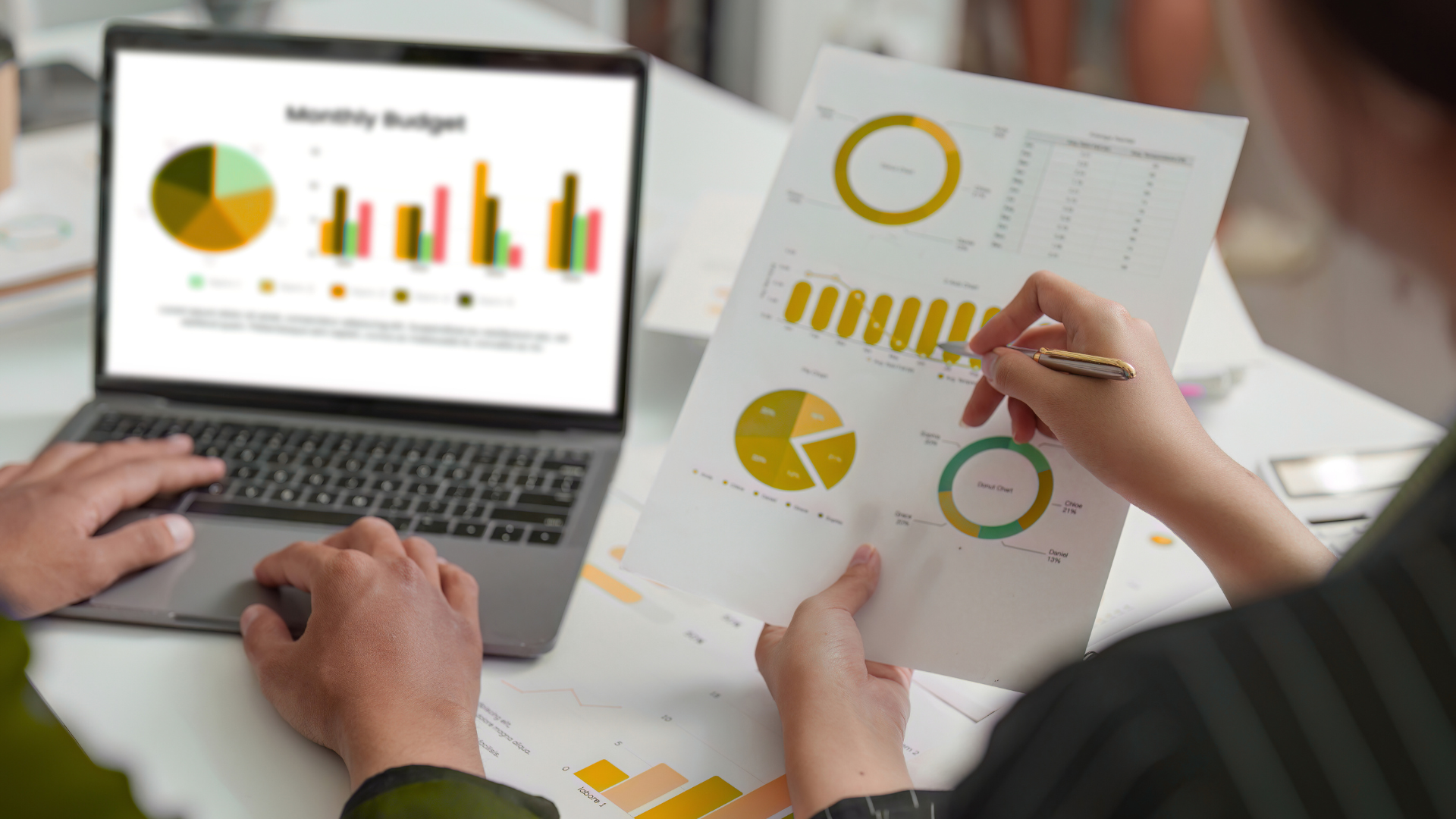 An image of a small business owner in Markham who is reviewing financial reports for their tech company