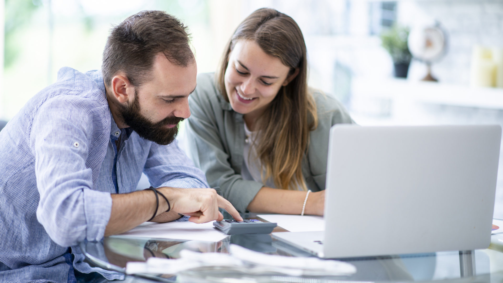 An image of a couple in Markham Ontario sitting together and reviewing their family finances